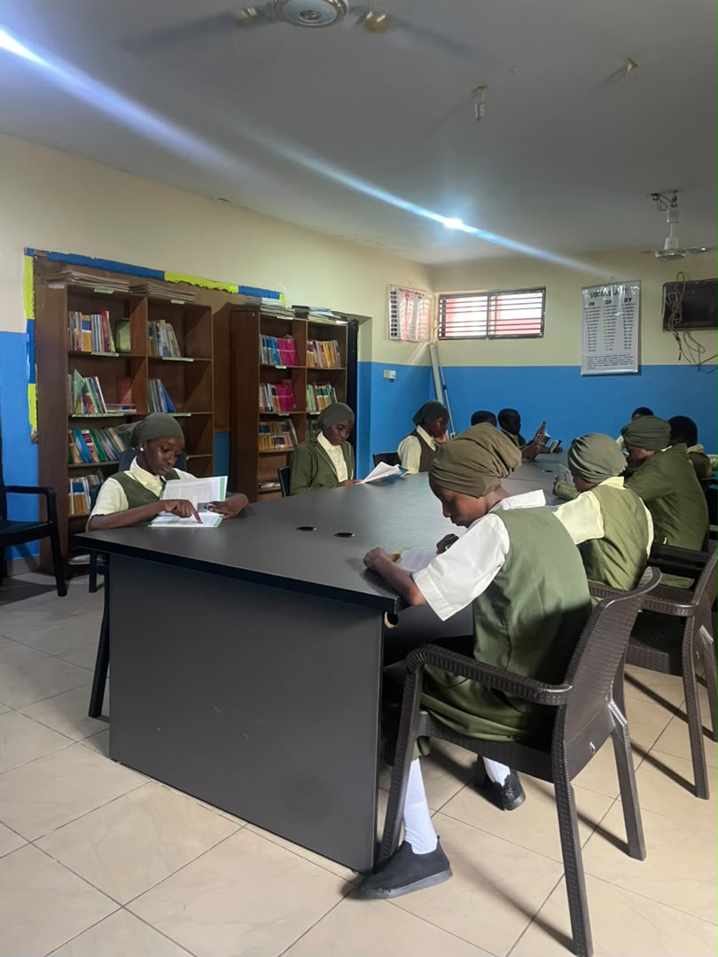 Students reading in the ACES library and resource centre